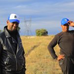IMG_1730 Luyolo Nguqe with a Black Excellence Luyolo Nguqe and a Black Excellence Versatile Agency promoter out in the field, repping the brand.